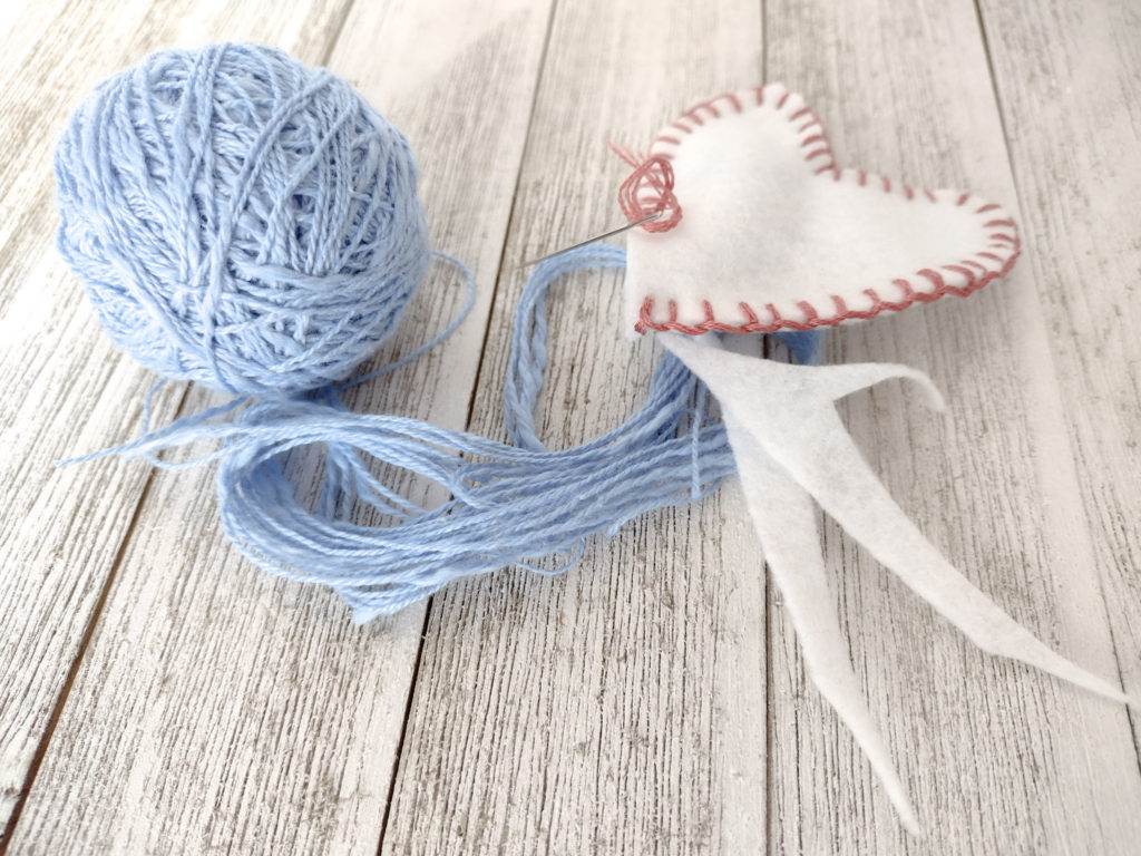 blue yarn and whit fabric stuffing for Valentines day heart